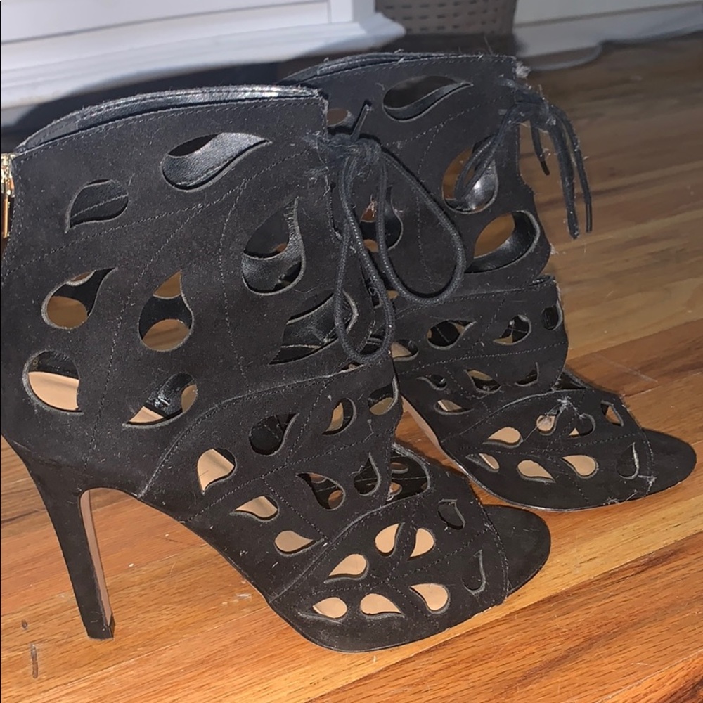 Black cut out, open toe heels. Zipper back